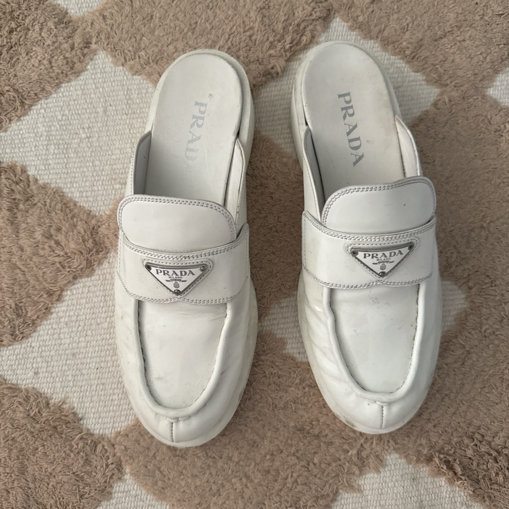 Prada White Leather Mules With Metal Logo
